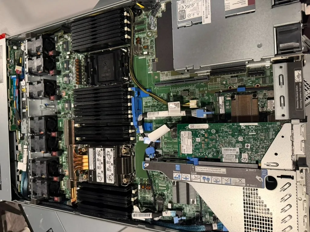 Riser cage and storage controller beside the DIMM banks.