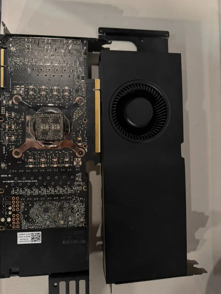 One card flipped to show the board and GPU retention plate next to the shroud.