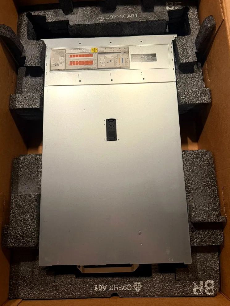 Chassis seated in factory foam, lid still on.