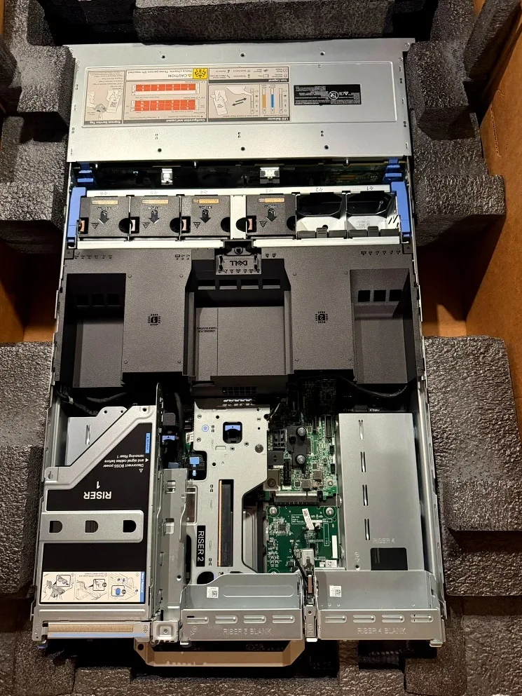 Lid off: riser cage, fan bank, and both CPU shrouds.