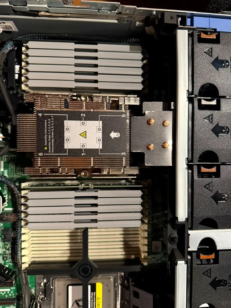 Installed EPYC heatsink between the DIMM banks, with the second socket blanked.
